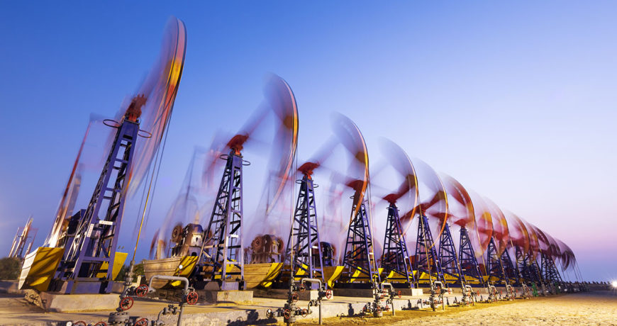 oil pumps working at oilfiled at dusk